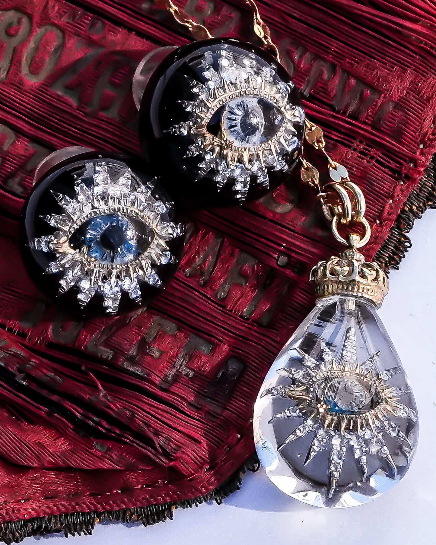 Guardian starburst eye earrings - black × gold