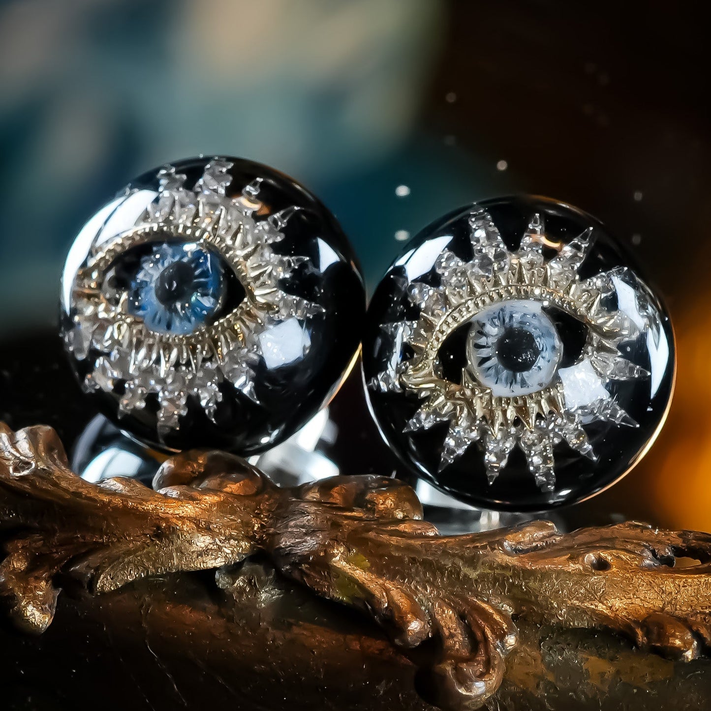 Guardian starburst eye earrings - black × gold