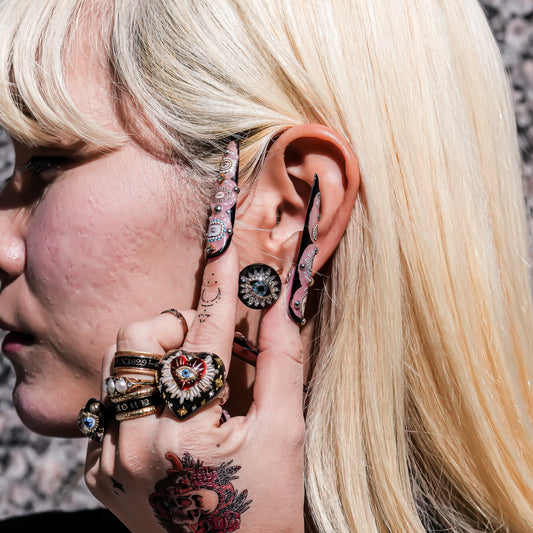 Guardian starburst eye earrings - black × gold