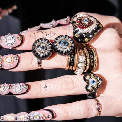 Guardian starburst eye earrings - black × gold