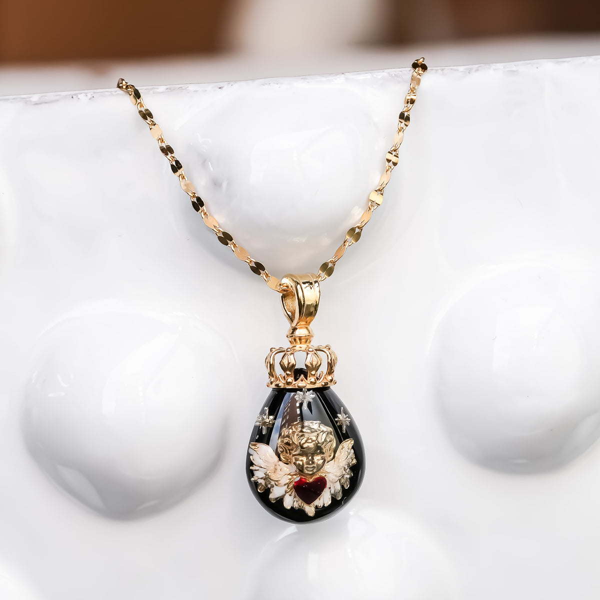 The Crowned Cherub Drop Necklace - Black × Gold