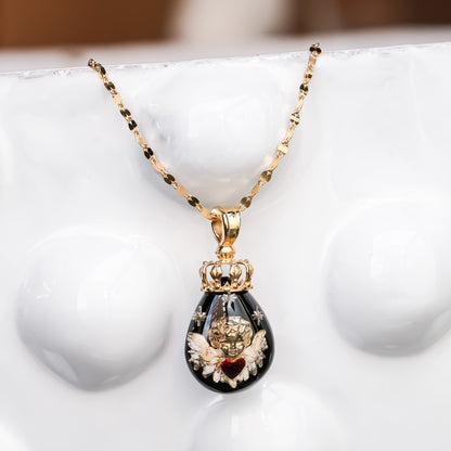 The Crowned Cherub Drop Necklace - Black × Gold