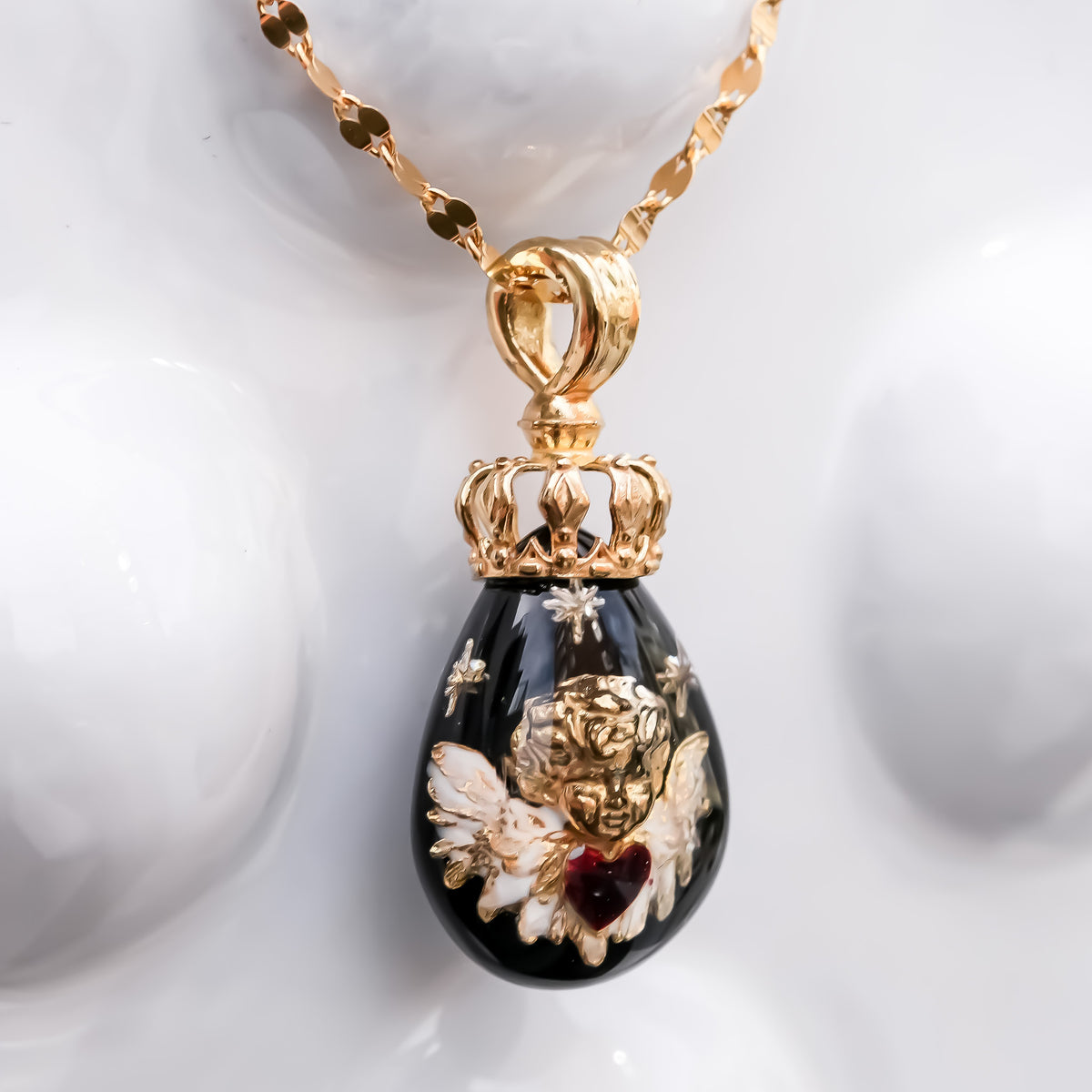 The Crowned Cherub Drop Necklace - Black × Gold