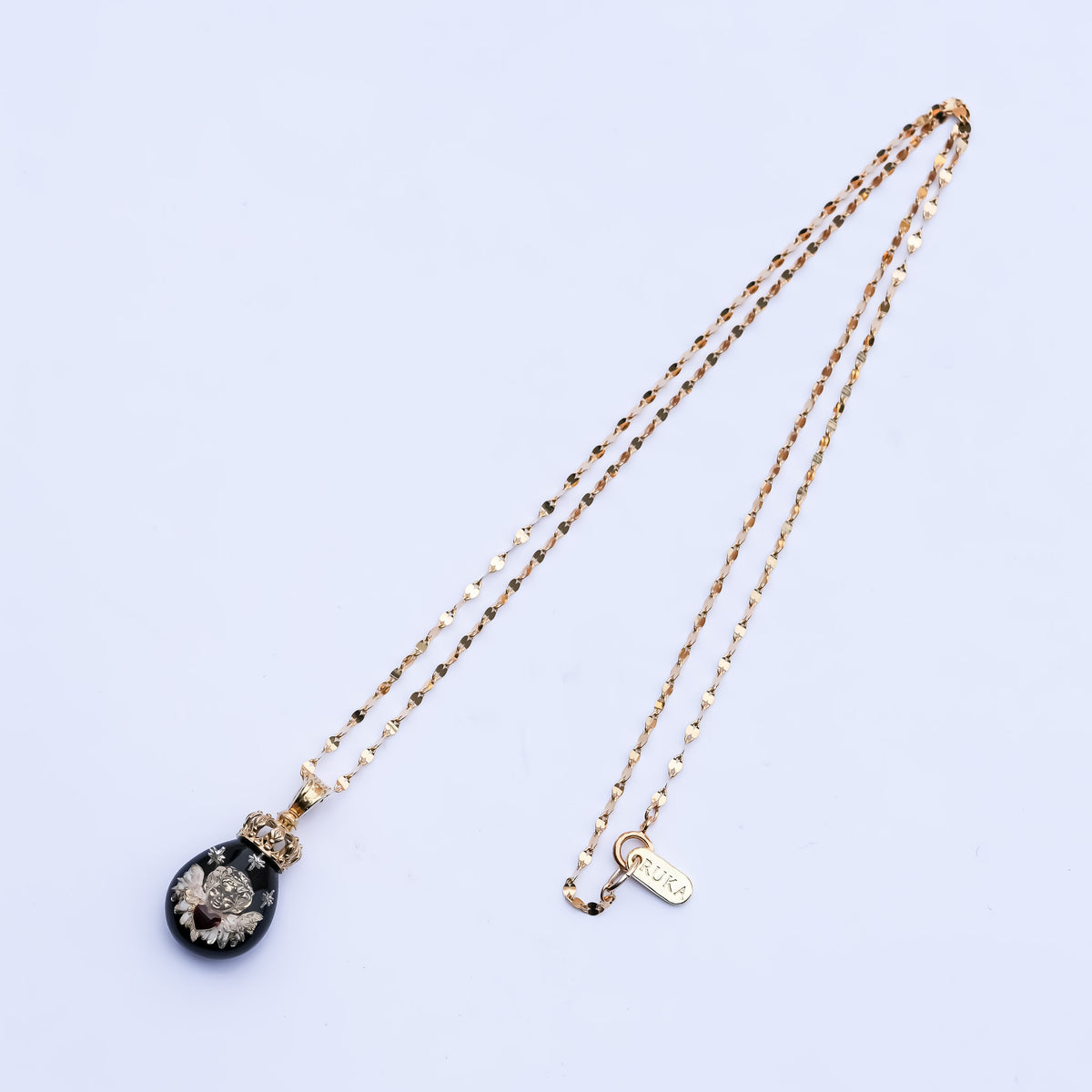The Crowned Cherub Drop Necklace - Black × Gold