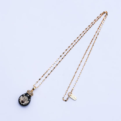 The Crowned Cherub Drop Necklace - Black × Gold